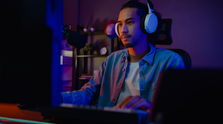 Man on computer playing games